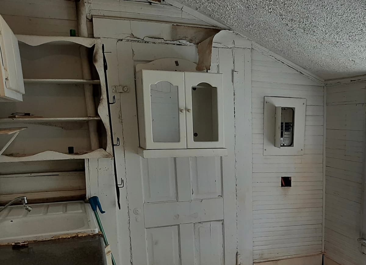 Adjoined Wall Soundproofing & Door Removal — Before
